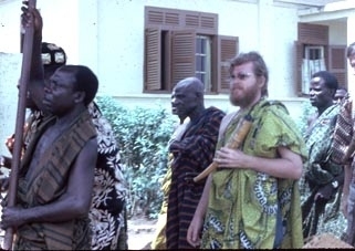 White guy walking in a procession in Ghana