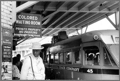 Man outside Colored Waiting Room sign, Durham, NC 1940