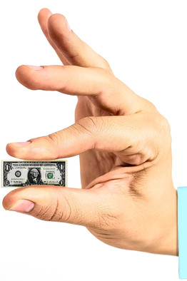 hand holding a tiny dollar bill