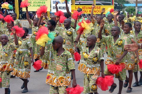People wearing the same clothes in a parade in Cameroon