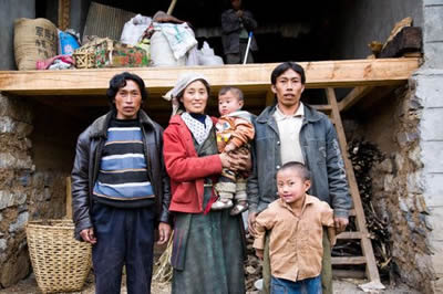Polyandry in Tibet, woman with two husbands and two children