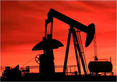 Oil well with red sky