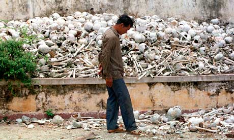 Man walks past enormous pile of human bones in Cambodia